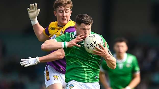 Iain Corbett, Limerick, and Jack Higgins, Wexford, in Tailteann Cup action. Photo by Tom Beary/Sportsfile