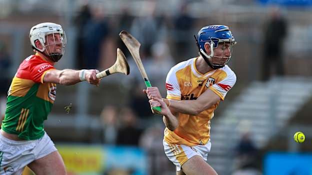 James McNaughton, Antrim, and Kevin McDonald, Carlow, in Allianz Hurling League action. Photo by Thomas Flinkow/Sportsfile