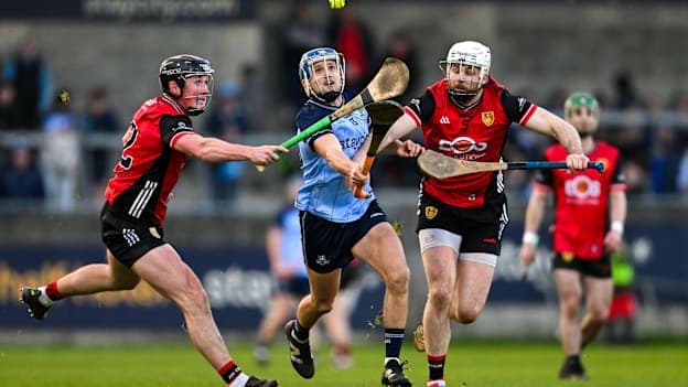 Dara Purcell, Dublin, and Niall McFarland and Barry Trainor, Down, in Allianz Hurling League action. Photo by Ramsey Cardy/Sportsfile