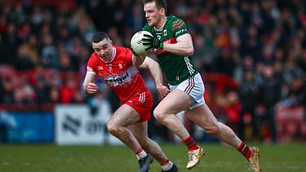 Mattie Ruane, Mayo, and Niall Toner, Derry, in Allianz Football League action. Photo by Ben McShane/Sportsfile